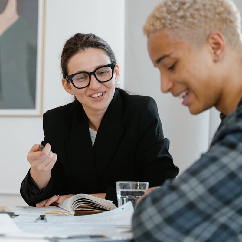 A Woman Tutoring a Young Man